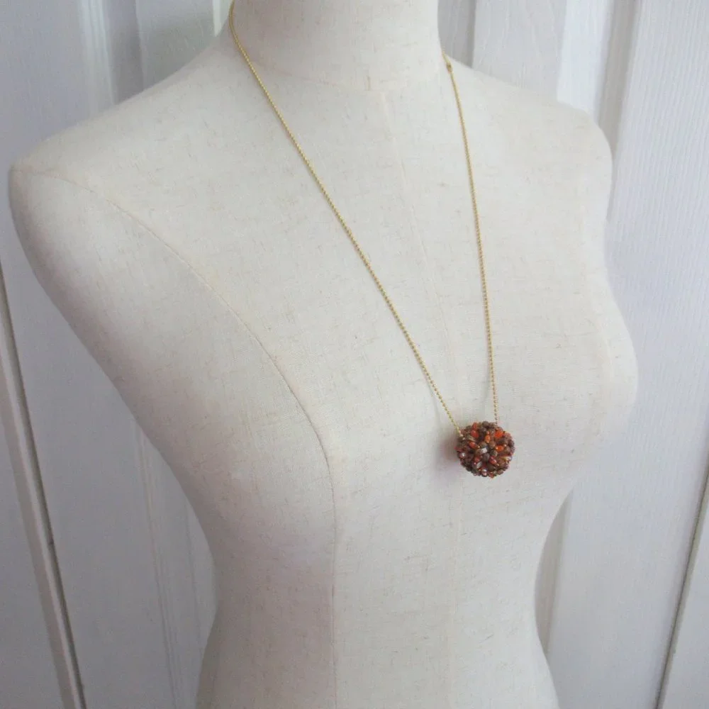 Handwoven Fall color beaded bead pendant
